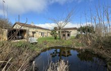 Detached old farmhouse with outbuildings