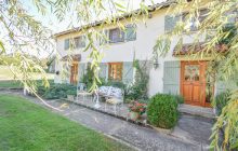 Two renovated, centrally-heated detached houses, two pools, gardens and land with views, lake, outbuildings