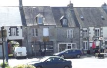 Double fronted shop at the centre of pretty Normandy village