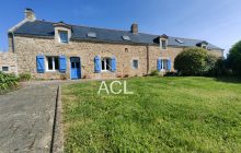 Stone property with outbuildings and a bucolic garden just steps from the sea