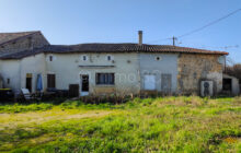 Stone house with outbuildings and land