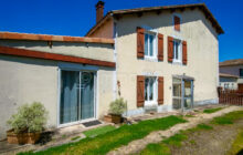 Two renovated stone town houses with outbuildings and garden